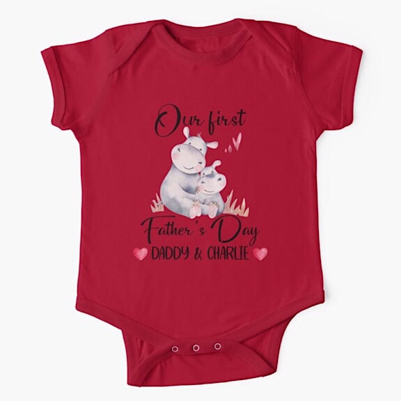 Personalised red short sleeved baby onesie bodysuit for daddys first fathers day with the names of both father and child combined with a watercolour painting of a daddy hippopotamus hugging a baby hippo