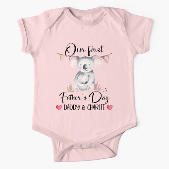 Personalised light pink short sleeved baby onesie bodysuit for daddys first fathers day with the names of both father and child combined with a watercolour painting of a daddy koala bear hugging a baby koala bear