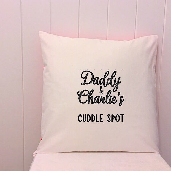 White cushion embroidered with Daddy & Charlie's cuddle spot perfect for a personalised fathers day present
