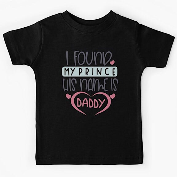 Black short sleeved kids tshirt with the words I Found my Prince His Name is Daddy with Daddy written with a pink heart