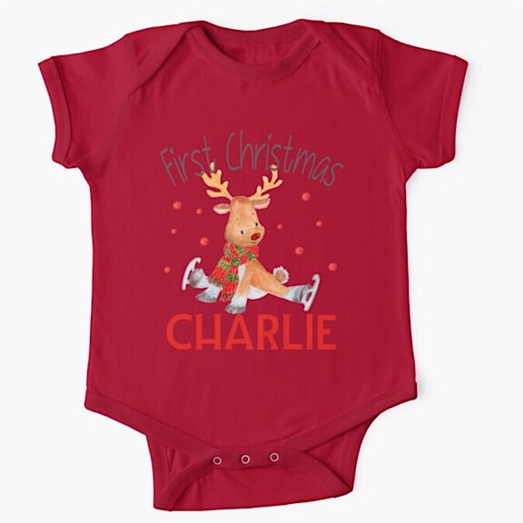 Personalised red short sleeved baby onesie bodysuit for first Christmas with a reindeer wearing a red and green scarf trying to ice skate