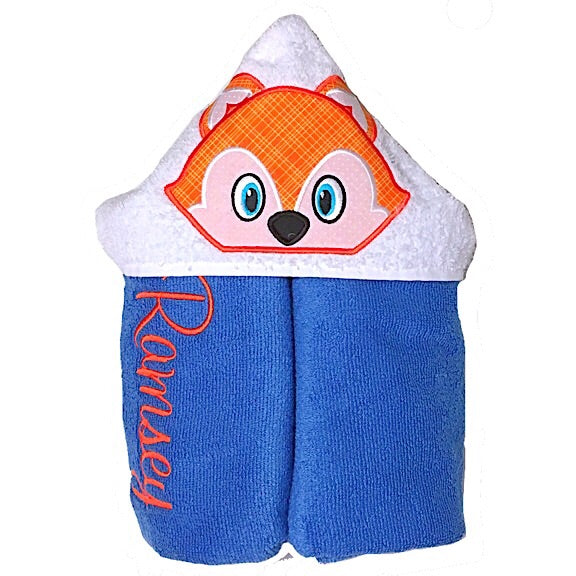 Hooded bath beach swim towel in blue with white hood. Hood has the face of orange and white fox appliquéd in the centre. Personalised with a name.