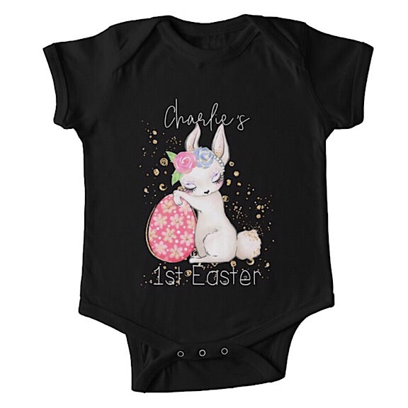 Short sleeved black baby onesie for a first easter with a sleepy bunny resting against an Easter egg  personalised with a name