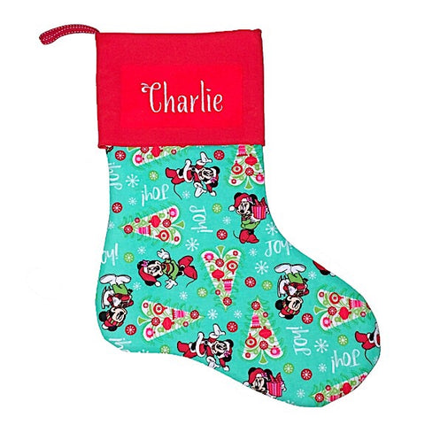 Large Christmas Stocking with a large red cuff personalised with a name.