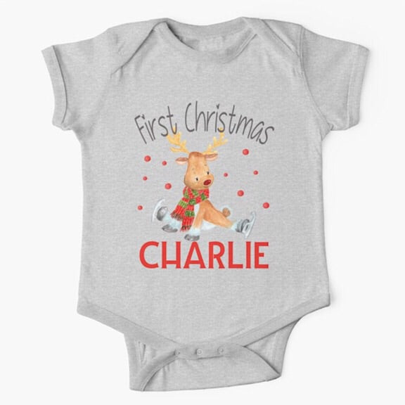Personalised light grey short sleeved baby onesie bodysuit for first Christmas with a reindeer wearing a red and green scarf trying to ice skate