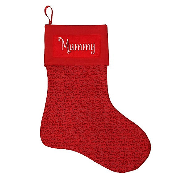 Large Christmas Stocking with a red background and the word love repeated over and over with a large red cuff personalised with a name.