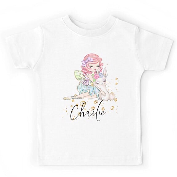 White short sleeved tshirt with a fairy girl cuddling a white easter bunny, personalised with a name