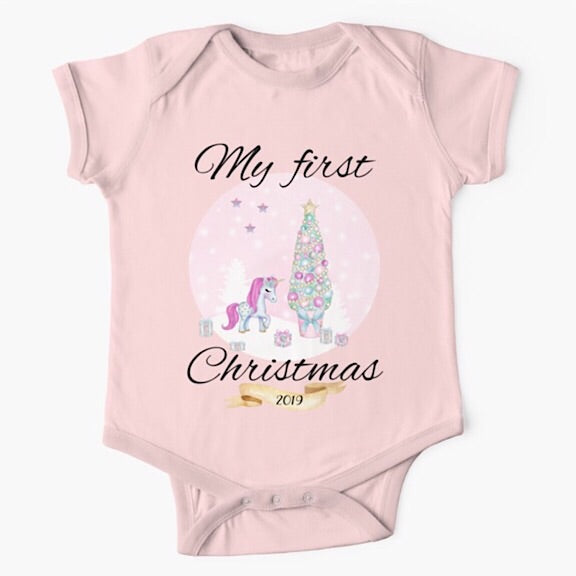 Personalised light pink short sleeved baby onesie bodysuit for first Christmas with a unicorn and christmas tree in pink and purple shades