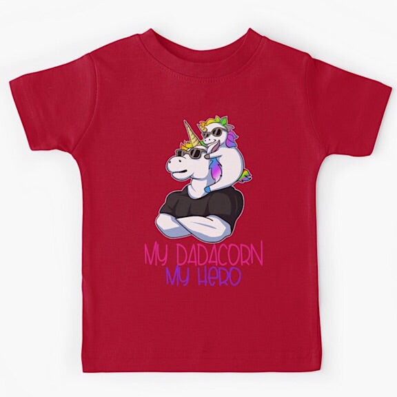 Red short sleeved kids tshirt with a muscly white father unicorn wearing a black tshirt with a baby unicorn on his shoulders with the words my dadacorn my hero underneath