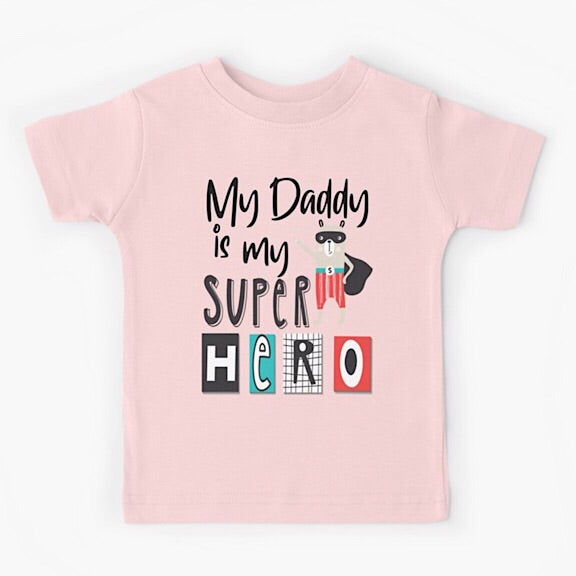 Light pink short sleeved kids tshirt with the words My Daddy is my Superhero with a bear wearing a black cape and mask and red striped pants