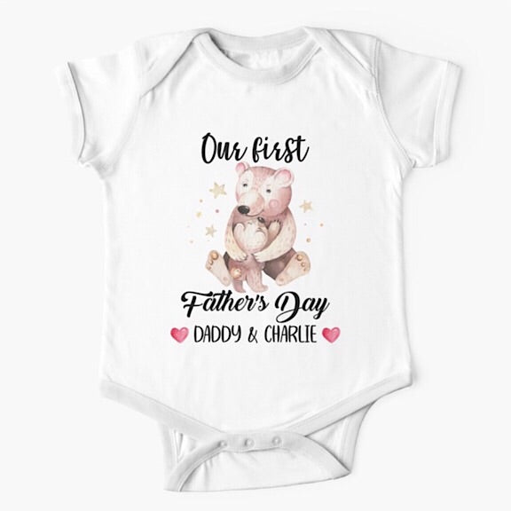 Personalised white short sleeved baby onesie bodysuit for daddys first fathers day with the names of both father and child combined with a watercolour painting of a papa bear hugging a baby bear