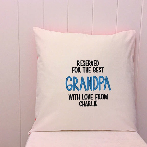 White cushion embroidered with Reserved for the Best Grandpa with Love from Charlie perfect for a personalised fathers day present
